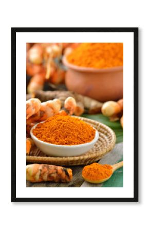 turmeric roots in the basket on wooden table