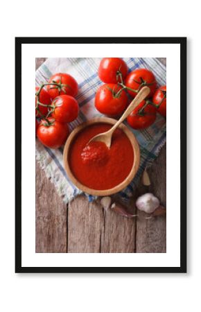 tomato sauce with garlic and basil in a bowl. vertical top view  