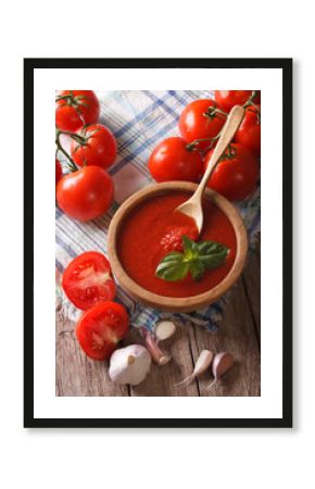 tomato sauce with garlic and basil in a wooden bowl. vertical  