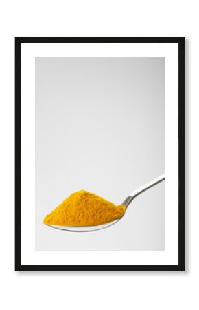 spoon of ground turmeric