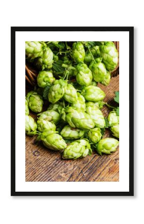 green hop cones in a basket on a table