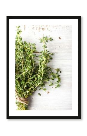 Bunch of thyme on the white board vertical