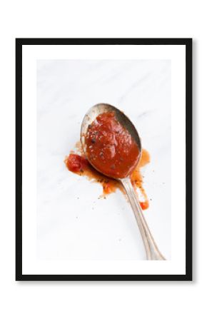 tomato sauce in the spoon, vertical