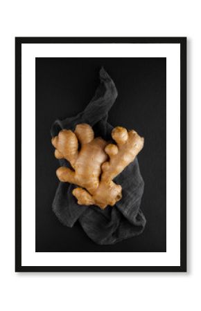 fresh ginger root on a napkin and slate plate kitchen table can be used as background