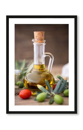 healthy olive oil and olive branch on the wooden table.