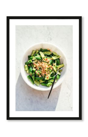 smashed cucumber salad in marble bowl