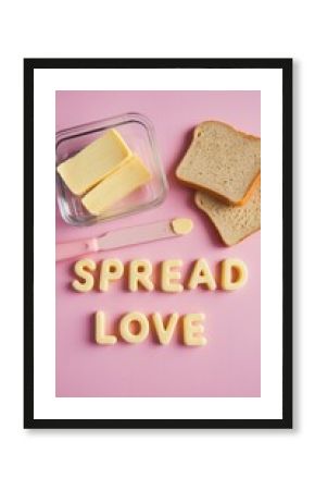 "SPREAD LOVE" food arrangement with bread, butter, and pink backdrop