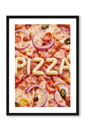 Close-up of Pizza with " PIZA" spelled out in Cheese