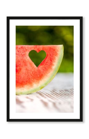 slice watermelon with a hole in the shape of heart