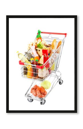 Shopping cart full with various groceries isolated on white