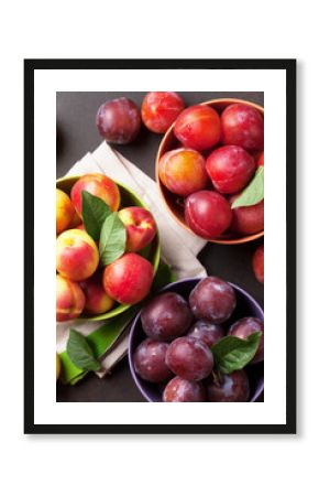 Fresh ripe peaches and plums