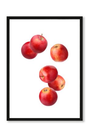 Falling red apples isolated on white.