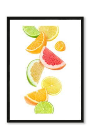 Isolated citrus fruits pieces in the air. Sliced orange, lemon, lime, grapefruit and kumquat falling isolated on white background with clipping path
