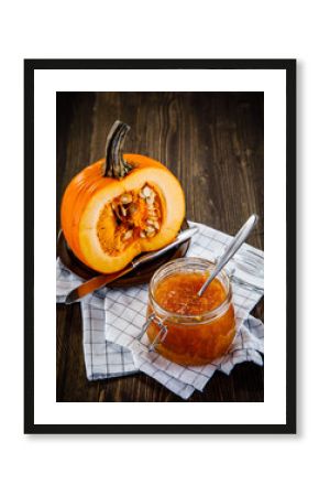 Pumpkin with jam on wooden background
