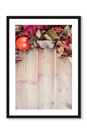 Overhead view of apple and leaves on table