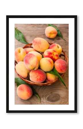 Ripe peaches in a wicker basket
