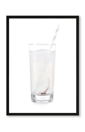 Glass of coconut water on white background