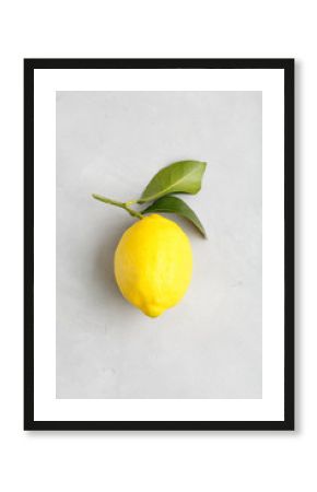 large ripe yellow lemon with leaves. traditional italian fruit Sicilian lemon on a light background top view.