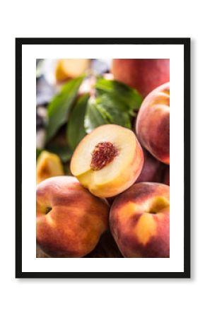 A group a ripe peaches on wooden table