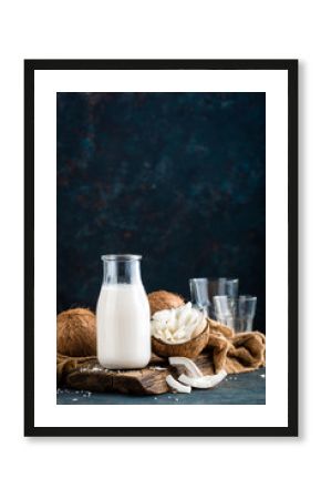 Fresh coconut milk in glass bottle, vegan non dairy healthy drink