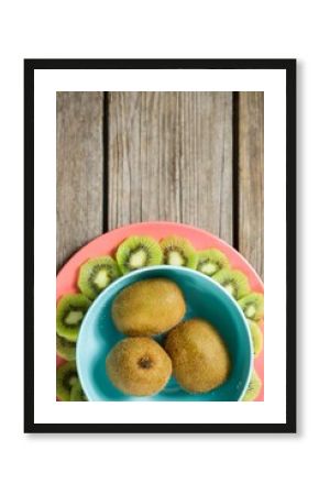 Kiwi fruits arranged on wooden table