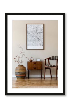 Modern composition of living room interior with brown mock up poster frame, design retro commode,  chair, etno basket with flower and elegant accessories. Template. Stylish home staging. Japandi.