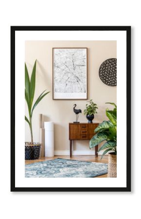 Modern scandinavian living room interior with brown mock up poster frame, design retro commode, rattan decor, carpet, plants, maps and elegant accessories. Template. Stylish home staging. Japandi.