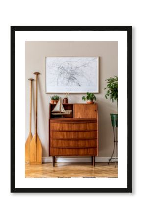 Stylish and vintage interior design of living room with wooden retro commode, plants, ships, paddle, map and elegant personal accessories. Mock up poster frame on the wall. Template. Home decor.