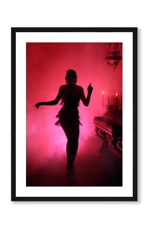 Dark silhouette in red smoke style retro woman. Girl dancing in vintage dress 