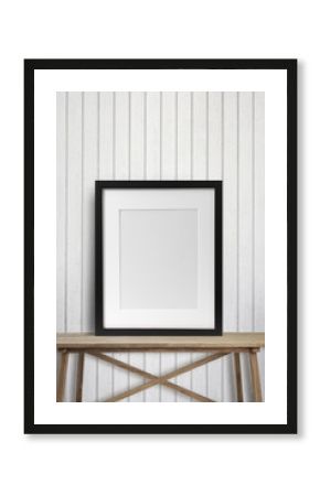 Black picture frame on wood table