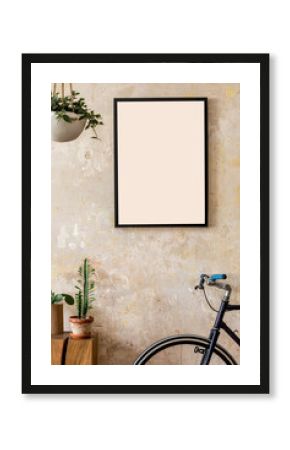 Modern composition of living room interior with black mock up poster frame, wooden cube, plant, cacti, hipster bike and personal accessories. Stylish home decor. Grunge wall. Wabi sabi. Template.
