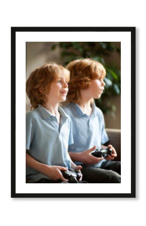 two brothers playing computer games together
